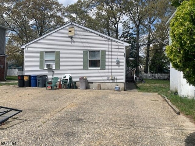 445 E Cape May, Ocean Gate Boro, NJ 08740 - rear view of property with crawl space and cooling unit