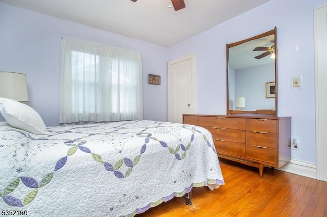 bedroom with wood finished floors and ceiling fan