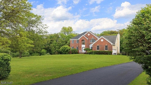 5 Dege Farm Rd, Tewksbury Twp, NJ 07830 - view of front of house with a chimney, a front lawn, and brick siding