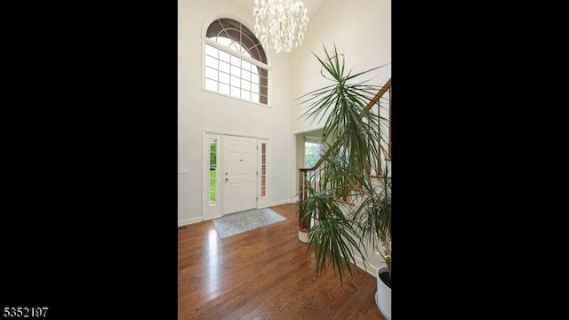 5 Dege Farm Rd, Tewksbury Twp, NJ 07830 - foyer entrance featuring a chandelier, a high ceiling, wood finished floors, and baseboards