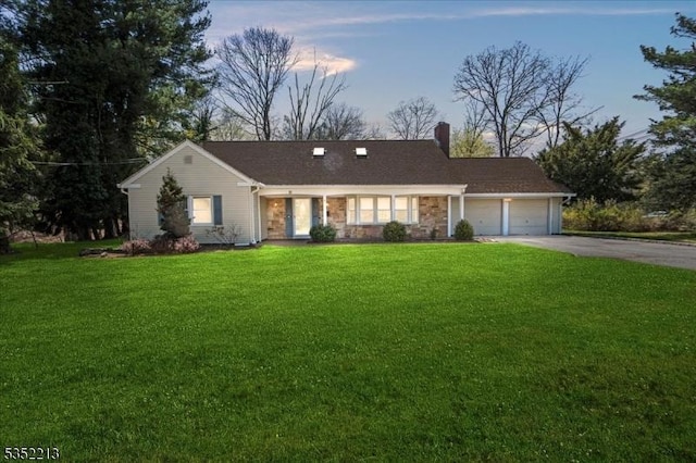 19 Tunnell Rd, Franklin Twp, NJ 08873 - single story home featuring a chimney, a front lawn, driveway, stone siding, and a garage