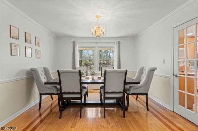 19 Tunnell Rd, Franklin Twp, NJ 08873 - dining area with crown molding, a chandelier, and light wood-style flooring