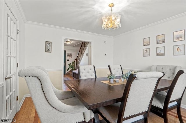 19 Tunnell Rd, Franklin Twp, NJ 08873 - dining area with ornamental molding, an inviting chandelier, and stairway