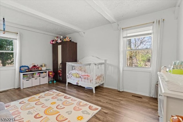 19 Tunnell Rd, Franklin Twp, NJ 08873 - bedroom featuring visible vents, baseboards, wood finished floors, and a textured ceiling