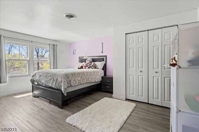 19 Tunnell Rd, Franklin Twp, NJ 08873 - bedroom with baseboards, wood finished floors, visible vents, and a closet