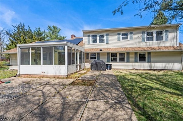 19 Tunnell Rd, Franklin Twp, NJ 08873 - rear view of house featuring a yard and a sunroom