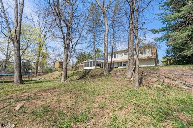 19 Tunnell Rd, Franklin Twp, NJ 08873 - view of yard featuring a trampoline