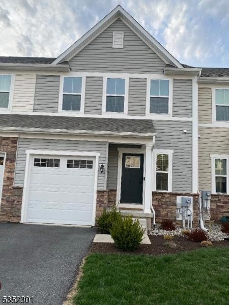 3 Sierra Pl, Sparta Twp, NJ 07871 - multi unit property featuring a garage, driveway, and stone siding