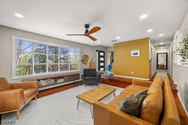 living area featuring a ceiling fan, recessed lighting, wood finished floors, and visible vents