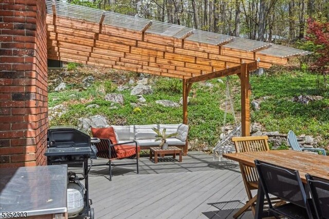deck with outdoor dining area, outdoor lounge area, and a pergola