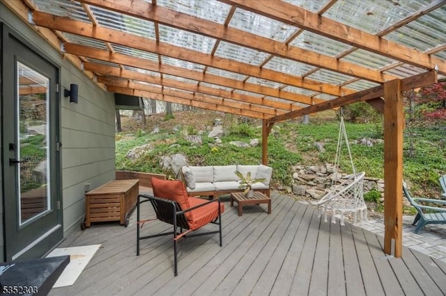 wooden terrace with an outdoor hangout area and a pergola