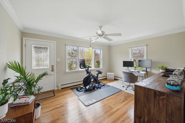 workout room featuring ceiling fan, wood finished floors, a baseboard radiator, a baseboard heating unit, and ornamental molding