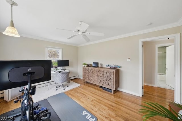 workout room featuring ceiling fan, crown molding, wood finished floors, baseboards, and a baseboard radiator