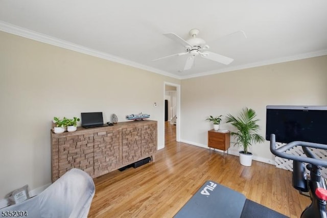 interior space with ceiling fan, visible vents, crown molding, wood finished floors, and baseboards