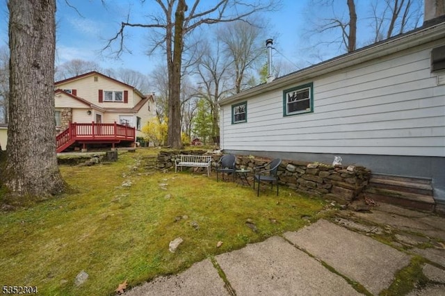 view of yard with a wooden deck