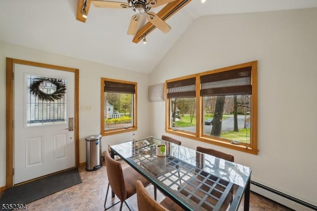 dining area with track lighting, a ceiling fan, vaulted ceiling, light wood-type flooring, and a baseboard heating unit