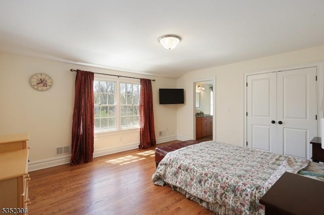 82 Queen Anne Dr, Bernards Twp, NJ 07920 - bedroom featuring a closet, wood finished floors, visible vents, and baseboards
