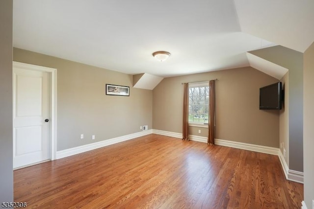 82 Queen Anne Dr, Bernards Twp, NJ 07920 - additional living space featuring vaulted ceiling, baseboards, and wood finished floors
