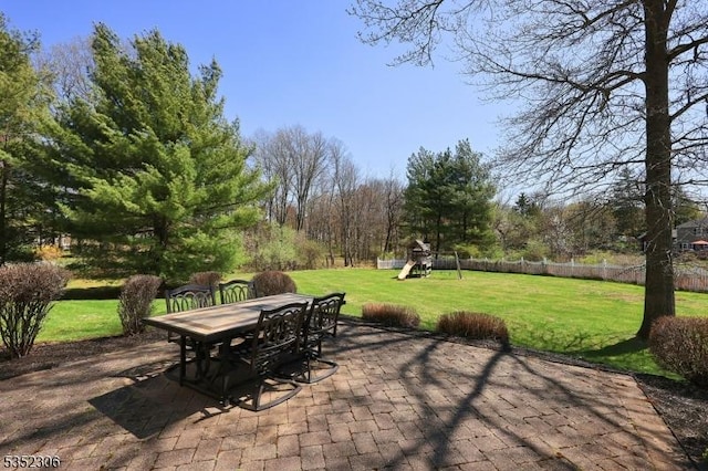 82 Queen Anne Dr, Bernards Twp, NJ 07920 - view of patio / terrace featuring outdoor dining area, fence, and a playground