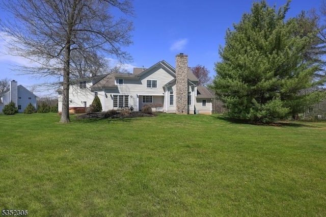 82 Queen Anne Dr, Bernards Twp, NJ 07920 - back of property featuring a yard and a chimney