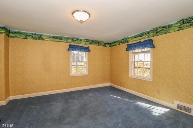 1775 Sleepy Hollow Ln, Plainfield City, NJ 07060 - empty room featuring plenty of natural light, dark colored carpet, and baseboards