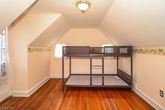 1775 Sleepy Hollow Ln, Plainfield City, NJ 07060 - unfurnished bedroom with hardwood / wood-style flooring, lofted ceiling, and baseboards