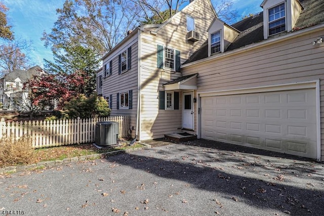 1775 Sleepy Hollow Ln, Plainfield City, NJ 07060 - view of side of home featuring asphalt driveway and central AC