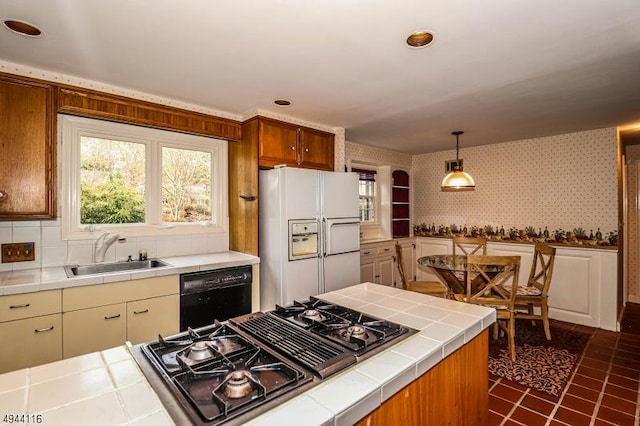 1775 Sleepy Hollow Ln, Plainfield City, NJ 07060 - kitchen with white fridge with ice dispenser, tile countertops, a sink, black dishwasher, and stovetop with downdraft
