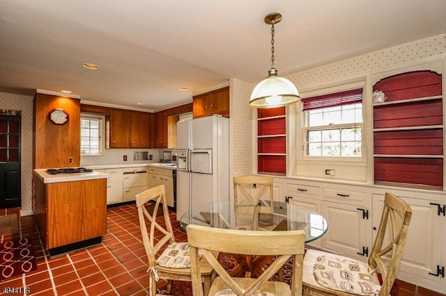 1775 Sleepy Hollow Ln, Plainfield City, NJ 07060 - kitchen featuring white fridge with ice dispenser, wallpapered walls, light countertops, decorative light fixtures, and white cabinetry