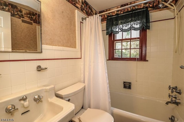 1775 Sleepy Hollow Ln, Plainfield City, NJ 07060 - full bath featuring toilet, shower / bath combo, tile walls, a sink, and a wainscoted wall