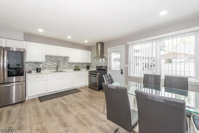 kitchen with a sink, appliances with stainless steel finishes, and a healthy amount of sunlight