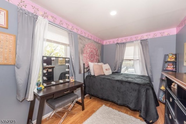 bedroom with wood finished floors