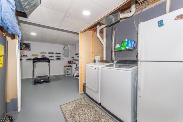 washroom with recessed lighting, washing machine and clothes dryer, and laundry area