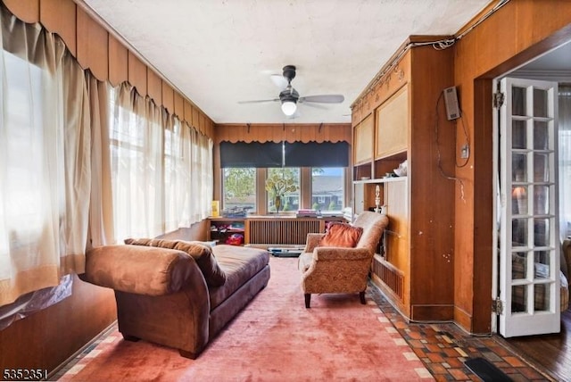 sunroom / solarium featuring radiator heating unit