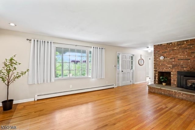 58 Water St, Tewksbury Twp, NJ 08833 - unfurnished living room featuring baseboard heating, wood finished floors, baseboards, and recessed lighting