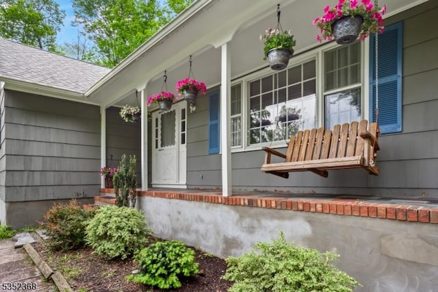 58 Water St, Tewksbury Twp, NJ 08833 - view of exterior entry with a porch and a shingled roof