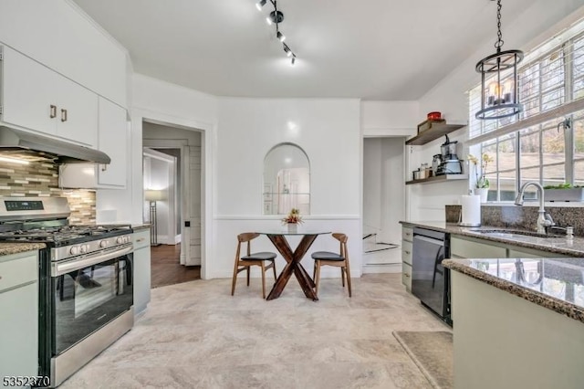 kitchen with hanging light fixtures, dishwasher, a sink, stainless steel gas range, and under cabinet range hood