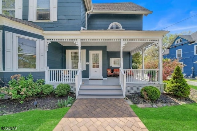 doorway to property with a porch