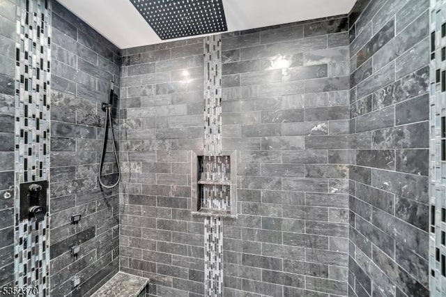 bathroom featuring tiled shower