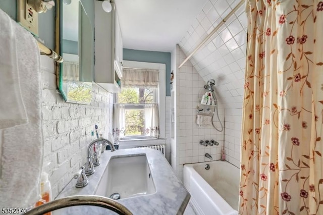 full bath featuring vanity and shower / bathtub combination with curtain
