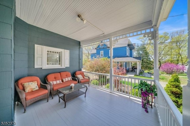 wooden deck featuring covered porch