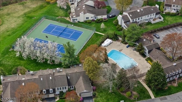 aerial view of property's location featuring a pool area