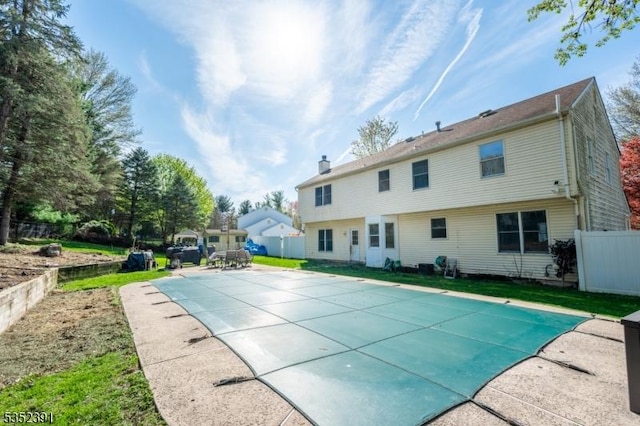 view of swimming pool featuring a patio, fence, and a fenced in pool