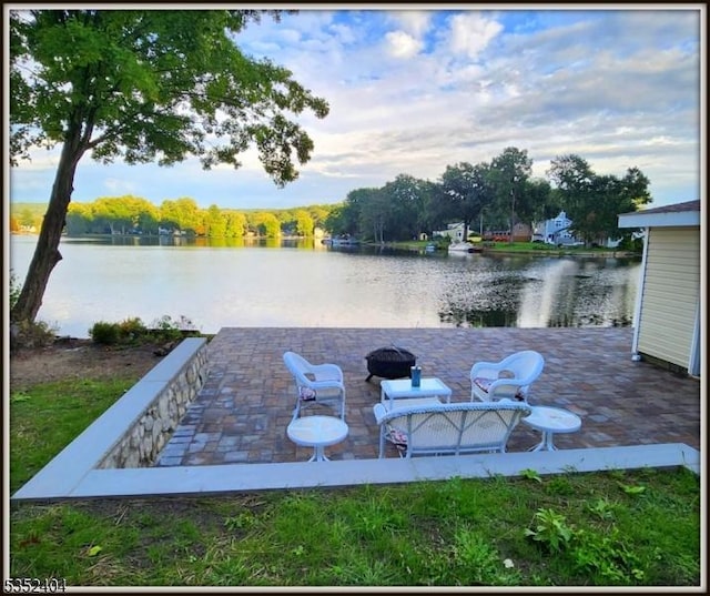 view of yard with a patio and a water view