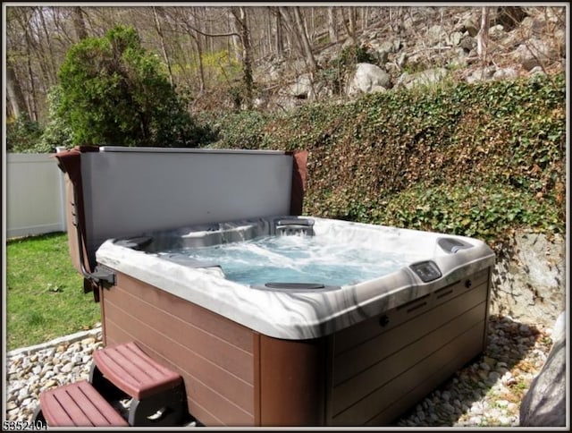 exterior space featuring a hot tub