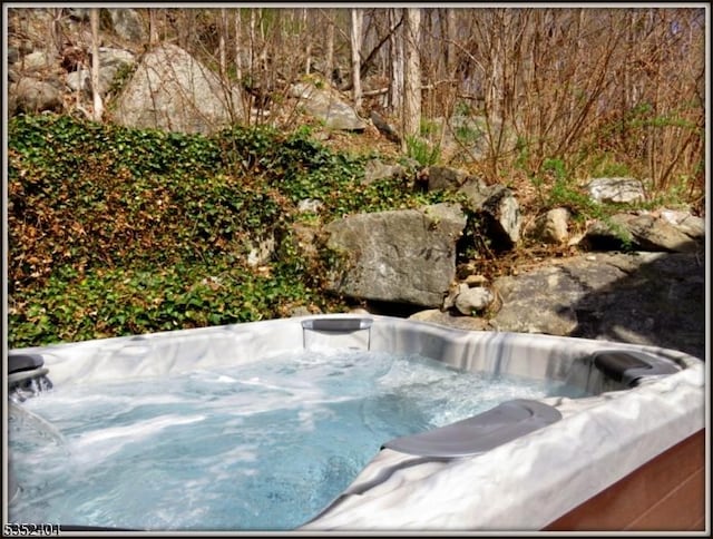 exterior space featuring a hot tub