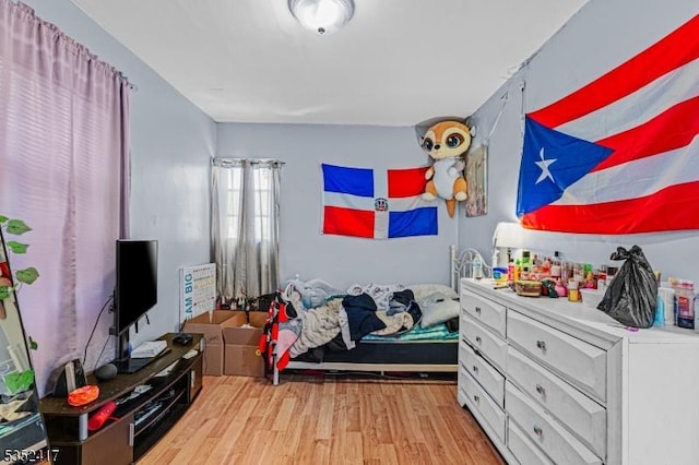 bedroom with light wood-style flooring