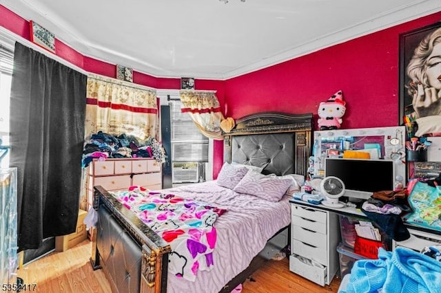 bedroom with wood finished floors