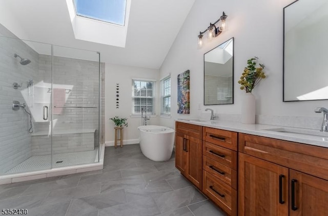 bathroom featuring a soaking tub, lofted ceiling with skylight, a sink, double vanity, and a shower stall