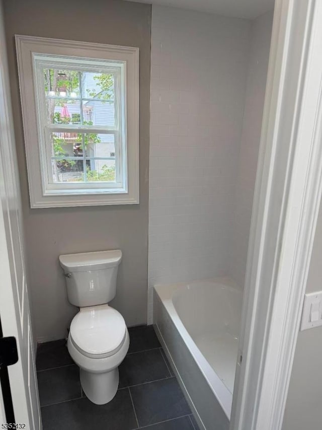 full bathroom with tile patterned flooring and toilet